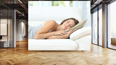 Girl sleeping or napping happy on a couch Wall mural