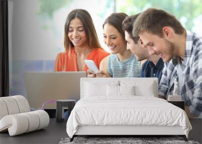 Group of friends using multiple devices at home Wall mural