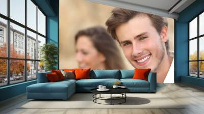 handsome man portrait with a perfect white tooth and smile Wall mural