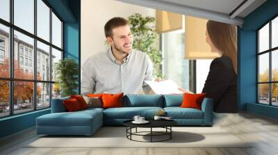 Man giving resume in a job interview Wall mural