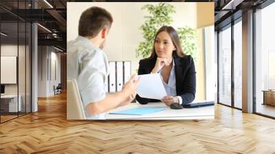 Man searching employment in a bad job interview Wall mural