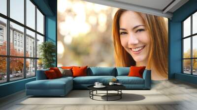 Portrait of a beautiful happy woman with a perfect white smile Wall mural