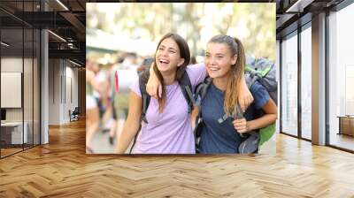 Two happy backpackers laughing enjoying vacation Wall mural