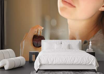 Woman hand applying fragrance on neck in the bathroom Wall mural