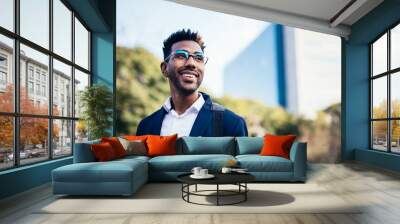 Portrait of dreamy young black man looking at infinity in a park Wall mural