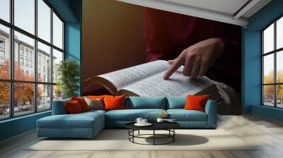 Christian teenager reading bible or book, Sunday readings bible. Concept for faith, spirituality and religion. Wall mural