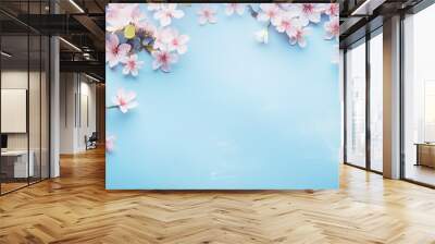 spring cherry blossom branches on turquoise blue background Wall mural