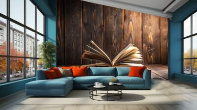 Macro study scene with books on dark wood backdrop an open book beckons exploration Wall mural