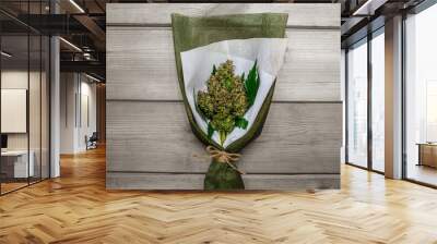 A bouquet of marijuana flowers on a wooden plank. Wall mural