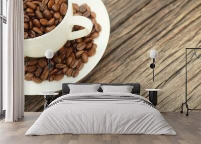 beans seed in cup of coffee on wooden table copy space Wall mural