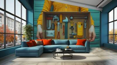 A woman is holding a box full of tools Wall mural