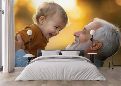 Grandfather and grandson share a joyful moment in a sunlit outdoor setting. Wall mural