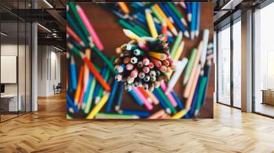 Stack of colored pencils in a glass Wall mural