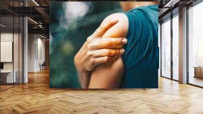 woman having pain in shoulder , health care concept Wall mural