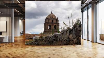 stone walls with a view of the church tower Wall mural