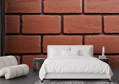 A close-up view of a red brick wall, showcasing the texture and arrangement of the bricks. Wall mural