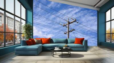 High voltage power transmission tower on blue sky background,  electricity distribution. Wall mural