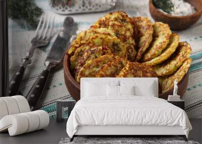 Zucchini fritters on brown plate, horizontal photo, closeup Wall mural