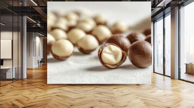 A close-up view of macadamia nuts showcasing their creamy texture and inviting colors Wall mural