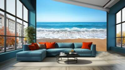 Serene beach with gentle waves on a sunny day Wall mural