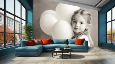 Young girl holding white balloons in a soft, neutral-toned setting during the afternoon Wall mural