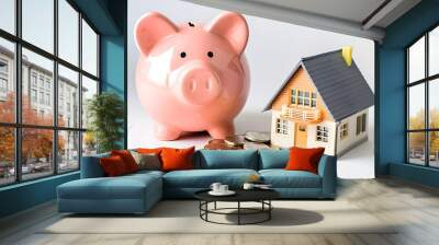 Savings for Home Investment with Piggy Bank and Model House Wall mural