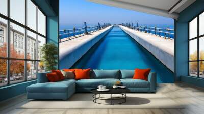 Tranquil Waterway with Blue Sky Reflection Wall mural