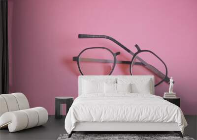 Broken glasses on the pink background Wall mural