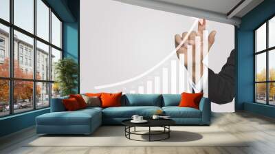 Hand touching graphs of financial indicator and accounting market economy analysis chart. Wall mural