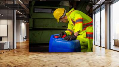 A Engineer industry wearing safety uniform ,black gloves and gas mask under checking chemical tank in industry factory work. Wall mural