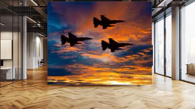 Silhouette army Show performant of air craft in air show with sun sky ocean view at sunset time background. Wall mural