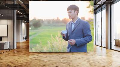 young man with digital tablet Wall mural