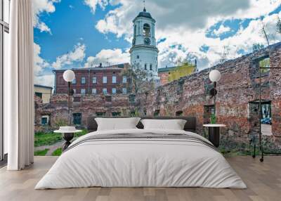 Clock tower through the opening of the old cathedral. Vyborg. Leningrad region. Russia Wall mural