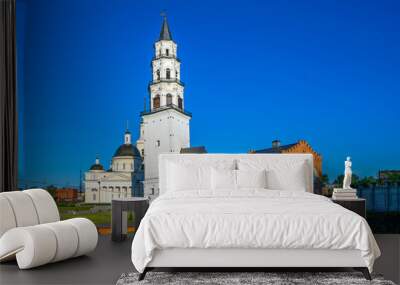 The inclined tower of Demidov, Transfiguration Cathedral and the building of the former power plant. Nevyansk. Sverdlovsk region. Russia Wall mural