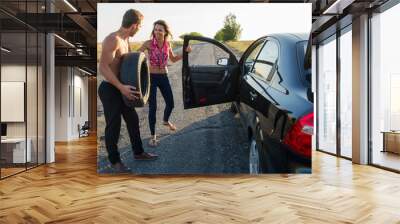 auto mechanic doing a tire change on the road. Wall mural