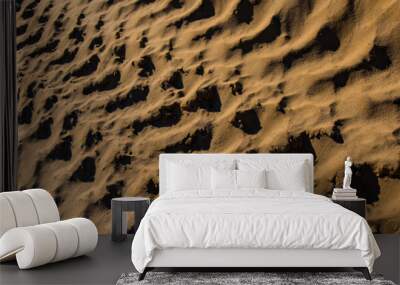 imprint of car tires on the sand surface. Wall mural