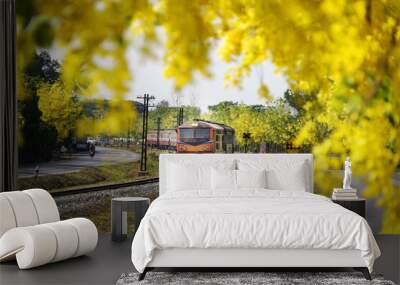 The Train railway transportation with Yellow flowers season in Chiang-Mai, Thailand.  Wall mural