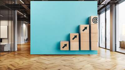 Business growth concept , wood block stacking as step stair on paper blue background, copy space. Wall mural