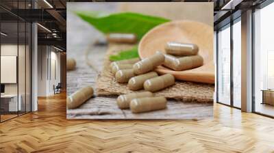 herbal medicine in capsules for healthy eating with herb leaf, alternative supplement for good living lifestyle  Wall mural