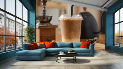 Iced coffee in plastic mugs on a wooden table Wall mural