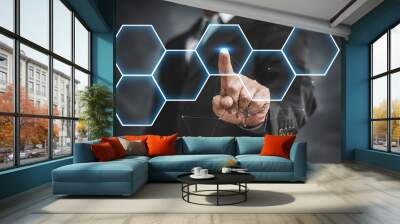 businessman touching virtual screen on hexagon Wall mural