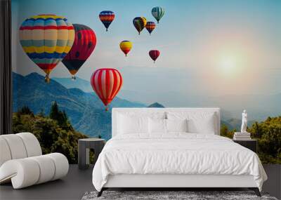 Beautiful view of mountain with hot air balloons on morning at Thailand. Wall mural