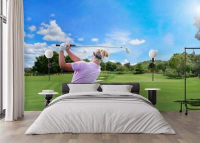 Professional woman golfer teeing golf in golf tournament competition at golf course for winner.   Wall mural