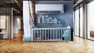 A compact air conditioner fitted in a small apartment's nursery, efficiently cooling the space where a crib is playfully decorated with urban skyline motifs. Wall mural