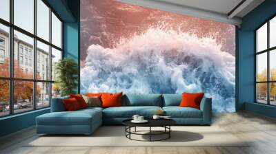 Vibrant ocean wave crashing against the shore, showcasing the beauty and power of nature's elements at sunrise. Wall mural