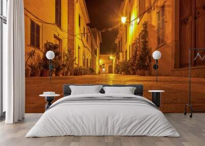 Image of a deserted street in a historic Spanish village in artificial light Wall mural