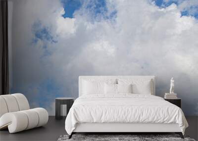 Image of a partly cloudy and partly clear sky during the day Wall mural