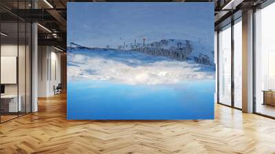 Panoramic view over snowy ski resort in Austrian Alps during daytime Wall mural