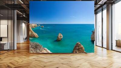 View on typical cliffy beach at Algarve coastline in Portugal in summer Wall mural