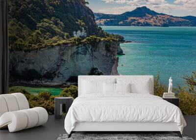 View over cliffy shore of Te Whanganui-A-Hei Marine Reserve on Northern island in New Zealand in summer Wall mural